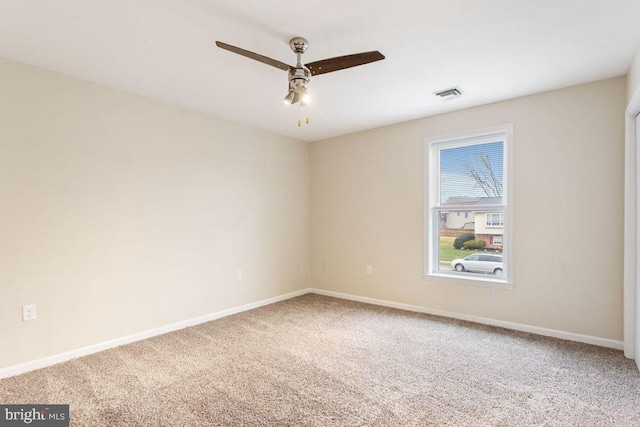 carpeted empty room with ceiling fan