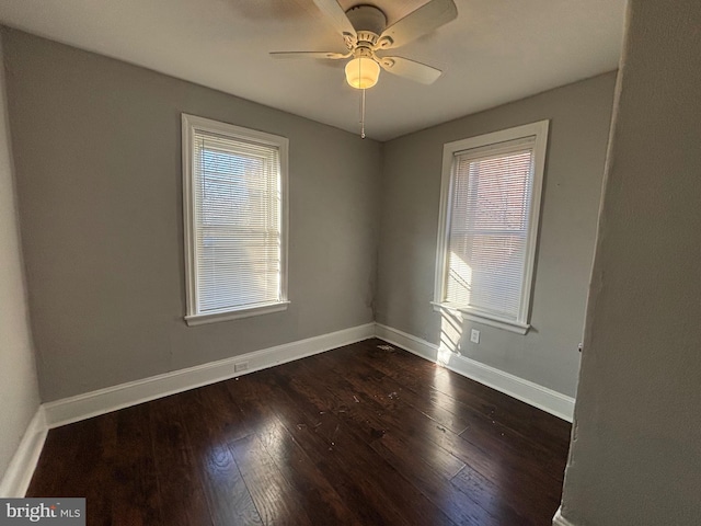 unfurnished room featuring dark hardwood / wood-style floors and ceiling fan