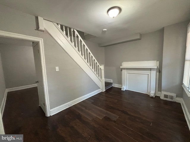 stairs featuring hardwood / wood-style flooring