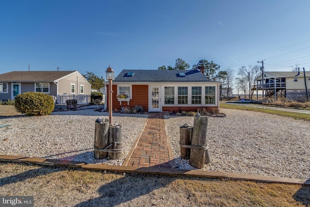 view of front of property with a sunroom