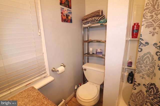 bathroom featuring tile patterned floors and toilet