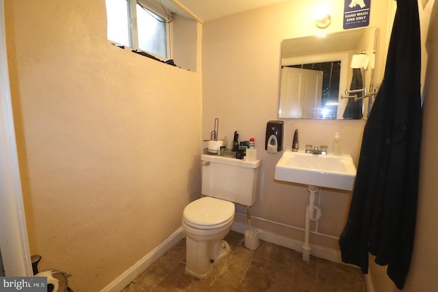 bathroom with toilet and sink