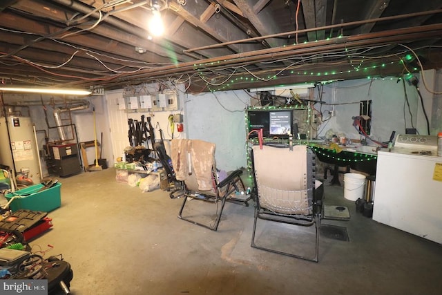 basement featuring gas water heater and washer / dryer