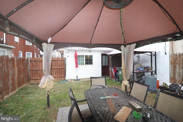 view of patio / terrace featuring a gazebo and an outdoor structure