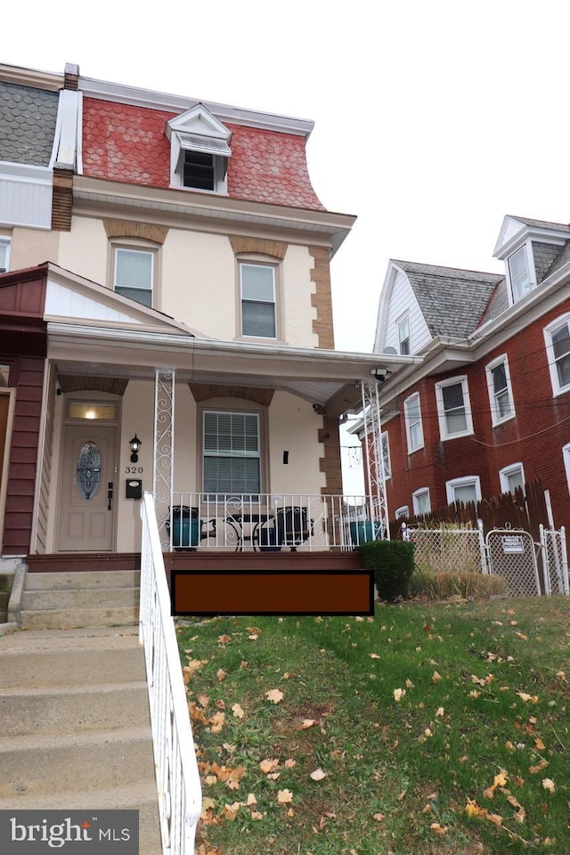 view of property with covered porch