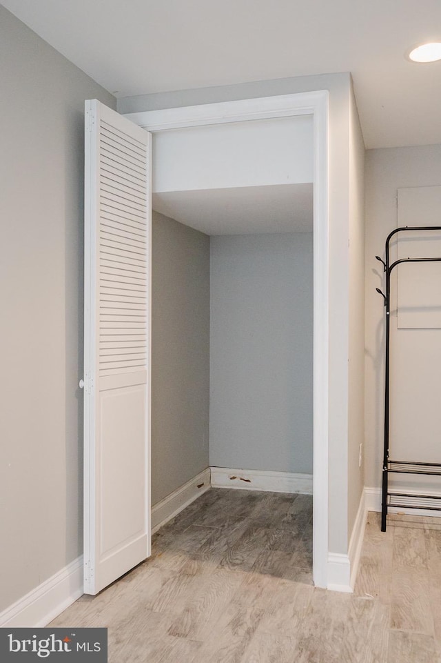 laundry room with light wood-type flooring