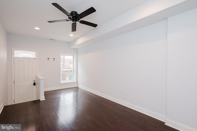 unfurnished room featuring dark hardwood / wood-style flooring and ceiling fan