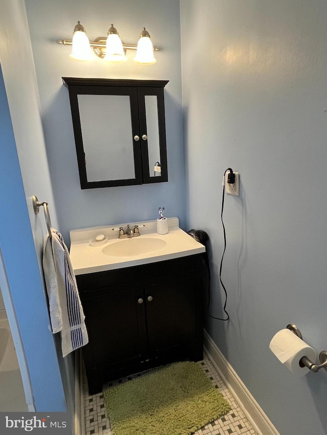 bathroom with tile patterned floors and vanity