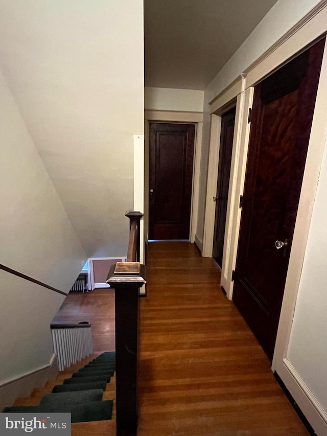 corridor featuring dark hardwood / wood-style flooring