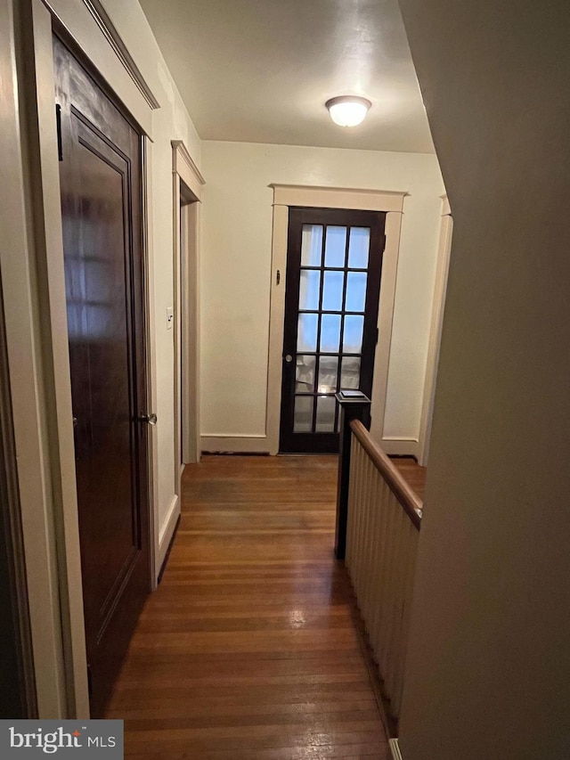 corridor with dark wood-type flooring