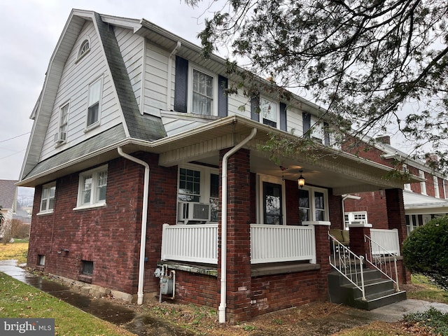 view of front of home with cooling unit and covered porch