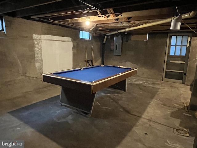 playroom featuring electric panel, billiards, a wealth of natural light, and concrete floors