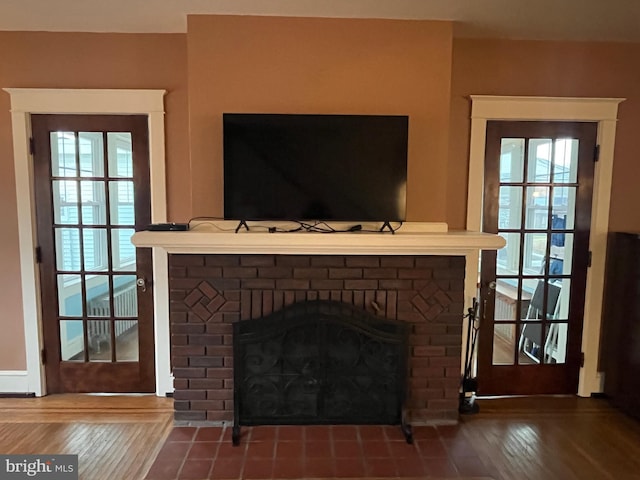 interior details with a fireplace and hardwood / wood-style flooring