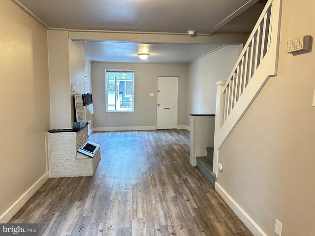 unfurnished living room with wood-type flooring