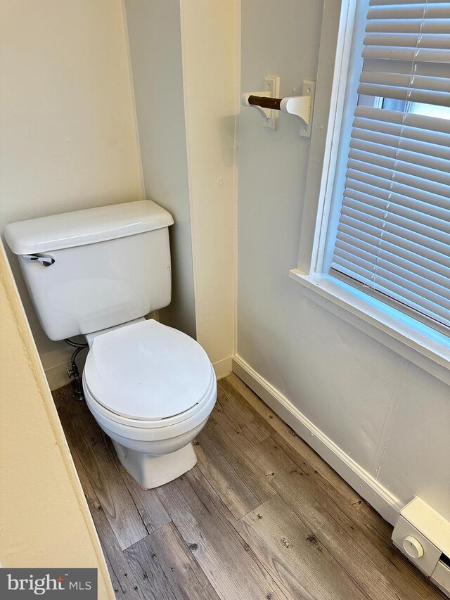 bathroom featuring toilet and hardwood / wood-style flooring