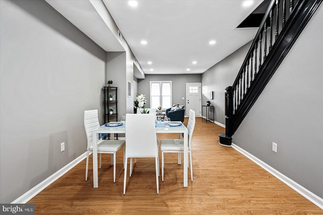 dining space featuring hardwood / wood-style floors