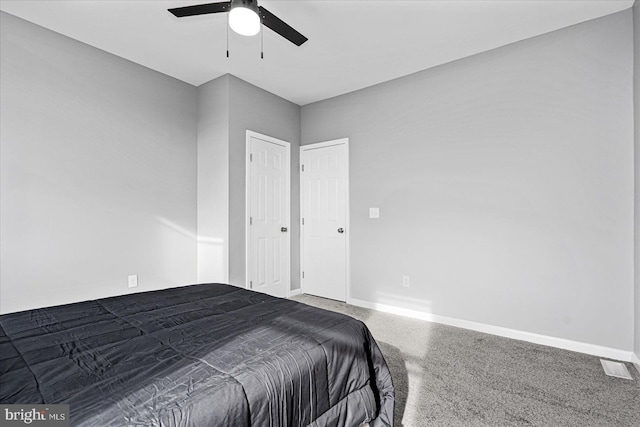 bedroom with ceiling fan and carpet floors