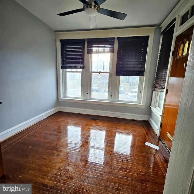 unfurnished room featuring hardwood / wood-style flooring and ceiling fan