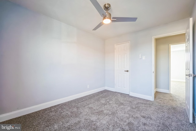 carpeted empty room featuring ceiling fan