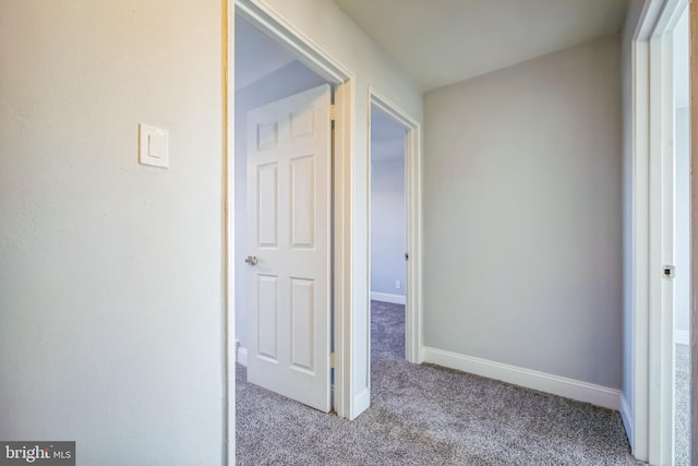 hallway with light carpet