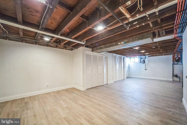 basement featuring wood-type flooring