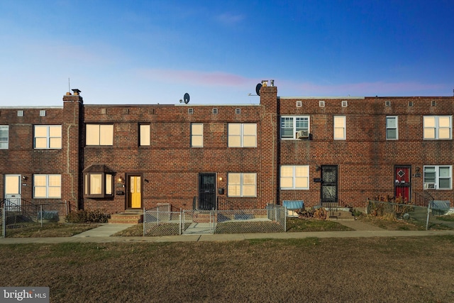 view of outdoor building at dusk