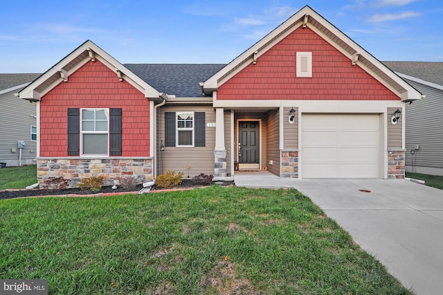 craftsman inspired home with a front yard and a garage