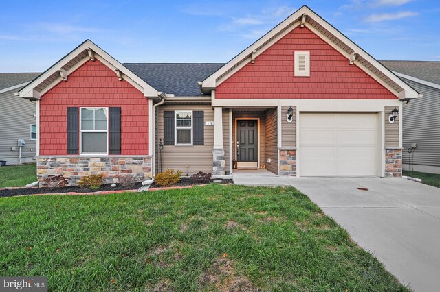 135 Casselberry Ln, Dover, DE 19904 - craftsman inspired home with stone siding, a front yard, driveway, an attached garage, and a shingled roof