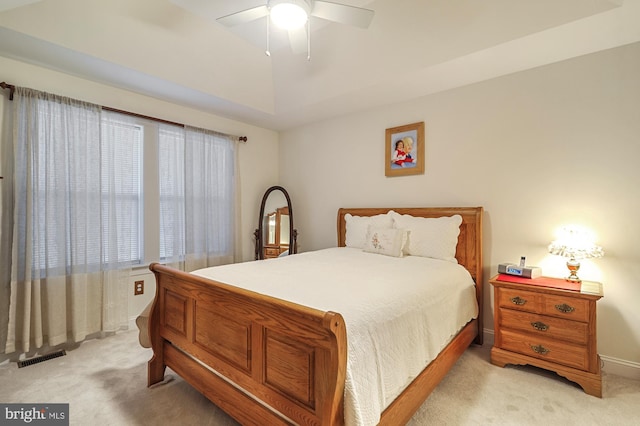 bedroom featuring light carpet and ceiling fan