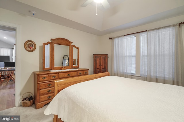 bedroom featuring ceiling fan and lofted ceiling