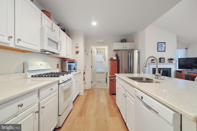 kitchen featuring white cabinetry, sink, crown molding, light hardwood / wood-style floors, and white appliances