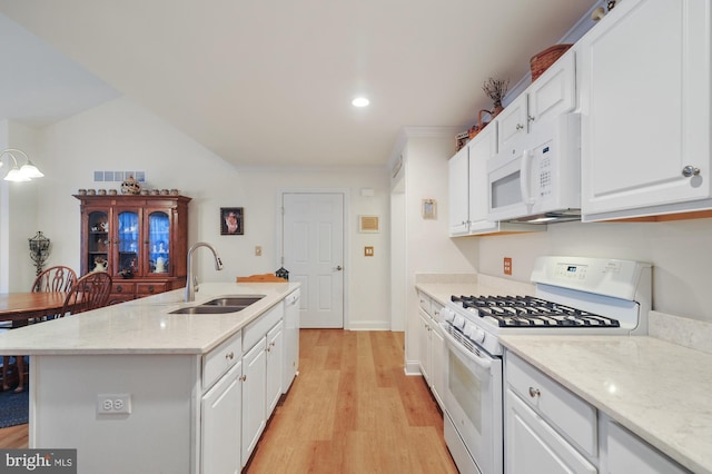 135 Casselberry Ln, Dover, DE 19904 - kitchen with white appliances, a sink, white cabinetry, light wood finished floors, and recessed lighting