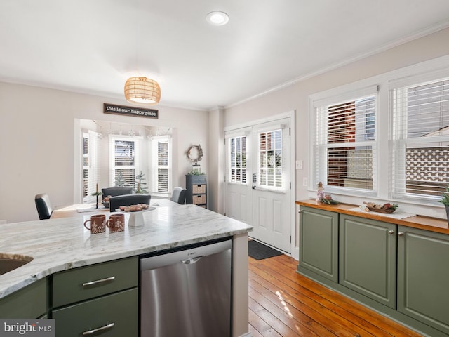 kitchen with light stone countertops, light hardwood / wood-style floors, stainless steel dishwasher, and crown molding