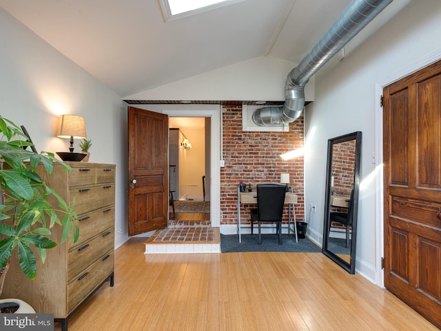 living room featuring lofted ceiling and light wood-type flooring