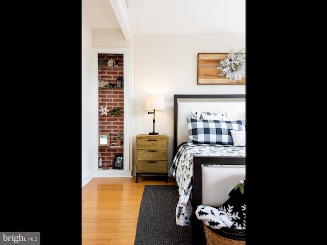 bedroom with wood-type flooring