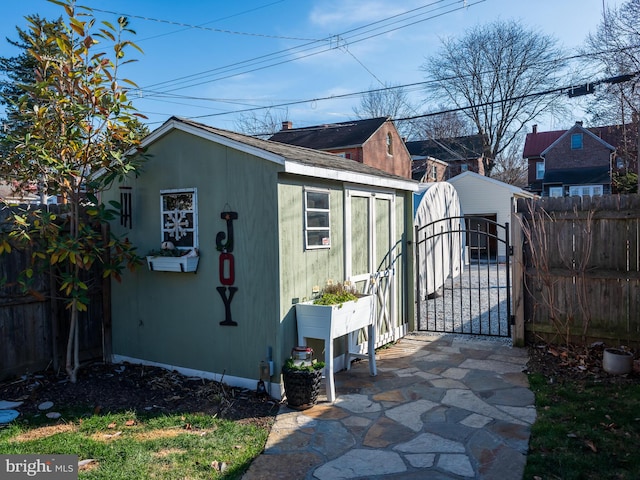 view of side of property featuring an outbuilding