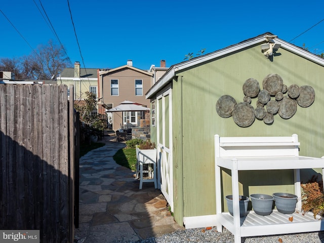 view of side of property featuring a patio area