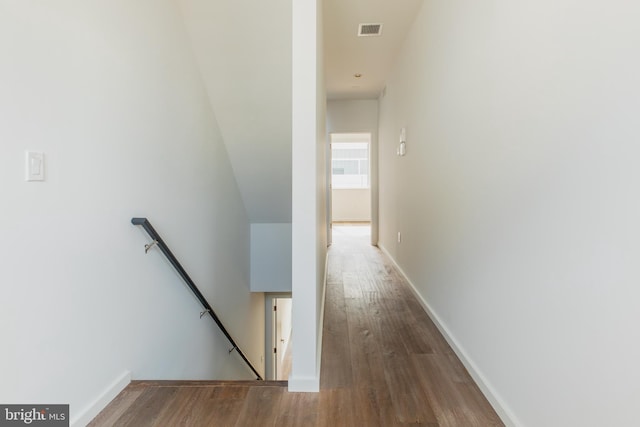 hallway with wood-type flooring