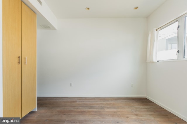 unfurnished room featuring light hardwood / wood-style floors