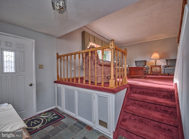 stairway featuring ornamental molding