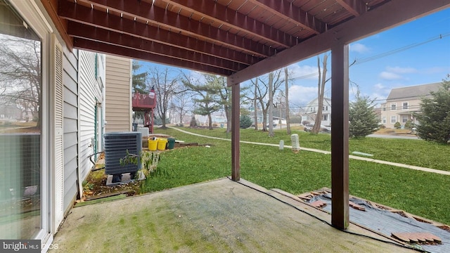 unfurnished sunroom featuring plenty of natural light, beam ceiling, and wood ceiling