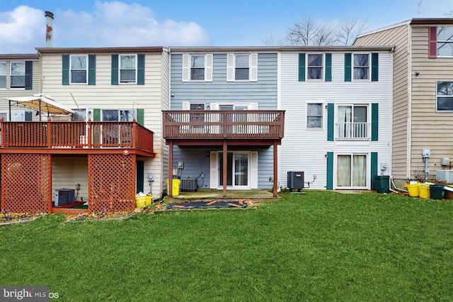 rear view of property with a lawn and cooling unit