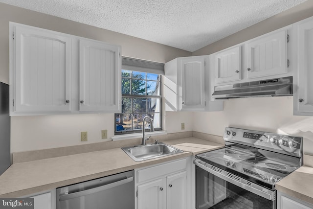 kitchen with sink, white cabinets, extractor fan, and appliances with stainless steel finishes