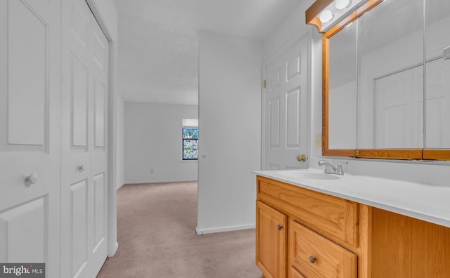 bathroom with vanity and a textured ceiling