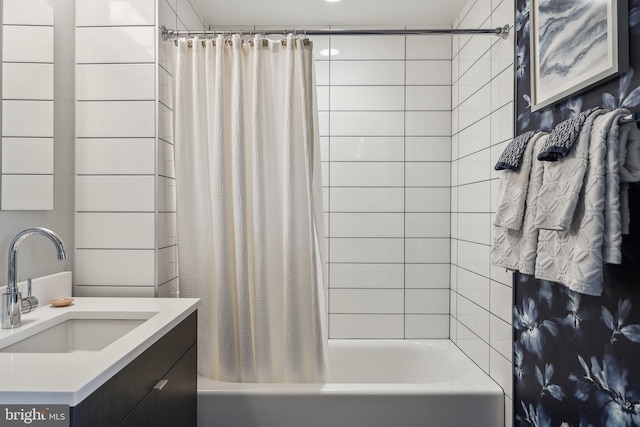 bathroom featuring shower / bath combo and vanity