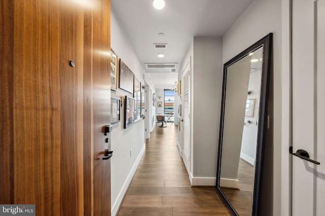 hall with dark wood-type flooring