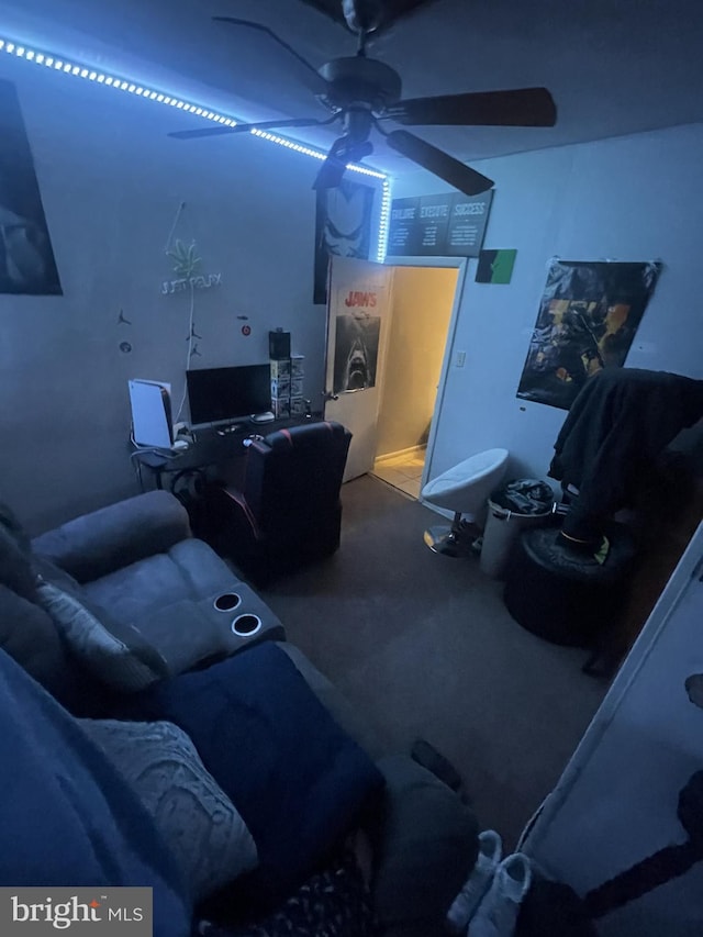 interior space featuring ceiling fan and carpet floors