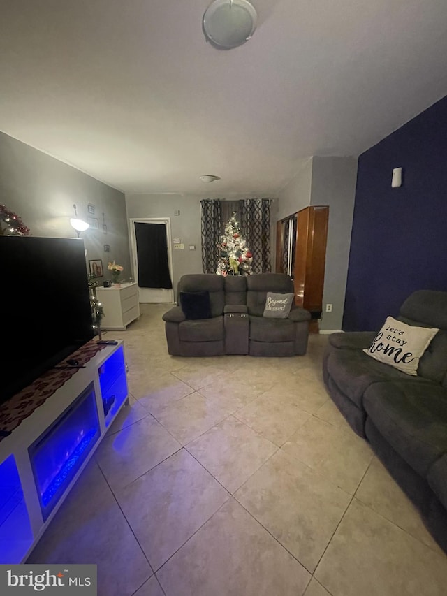 living room with light tile patterned flooring