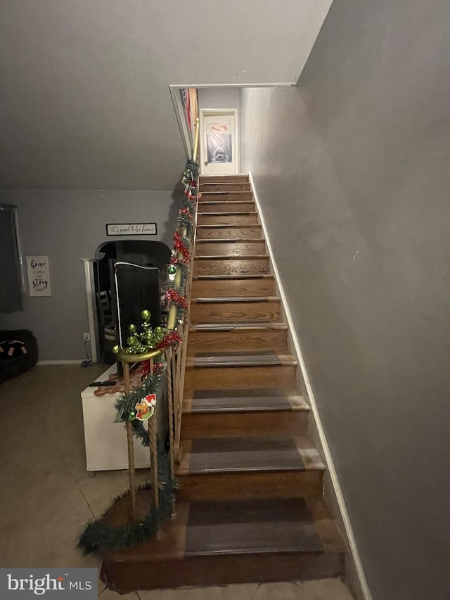 staircase with tile patterned floors