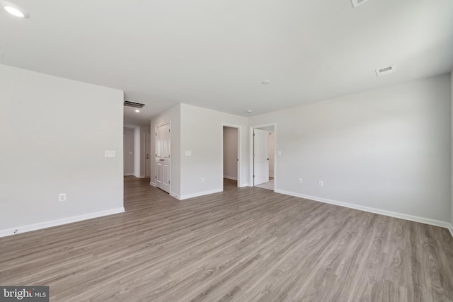 spare room with light wood-type flooring